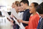 Group,Of,School,Children,Singing,In,Choir,Together